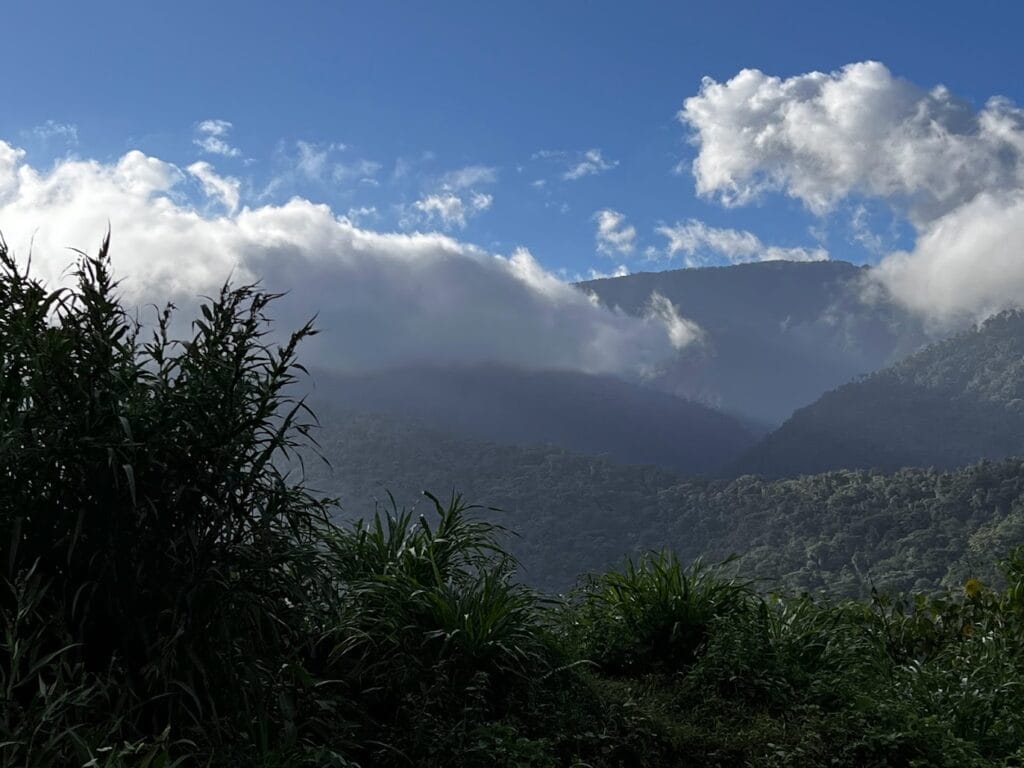 Cloud pouring over a forested mountain ridge in Costa Rica's highlands