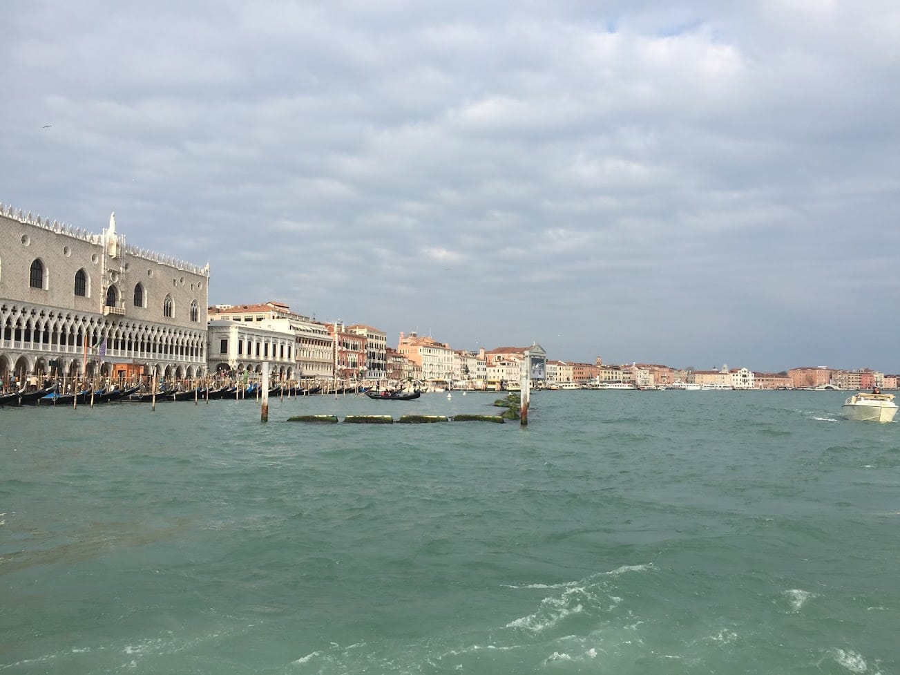 The Doge's Palace and the Venice waterfront seen from the water on a grey day