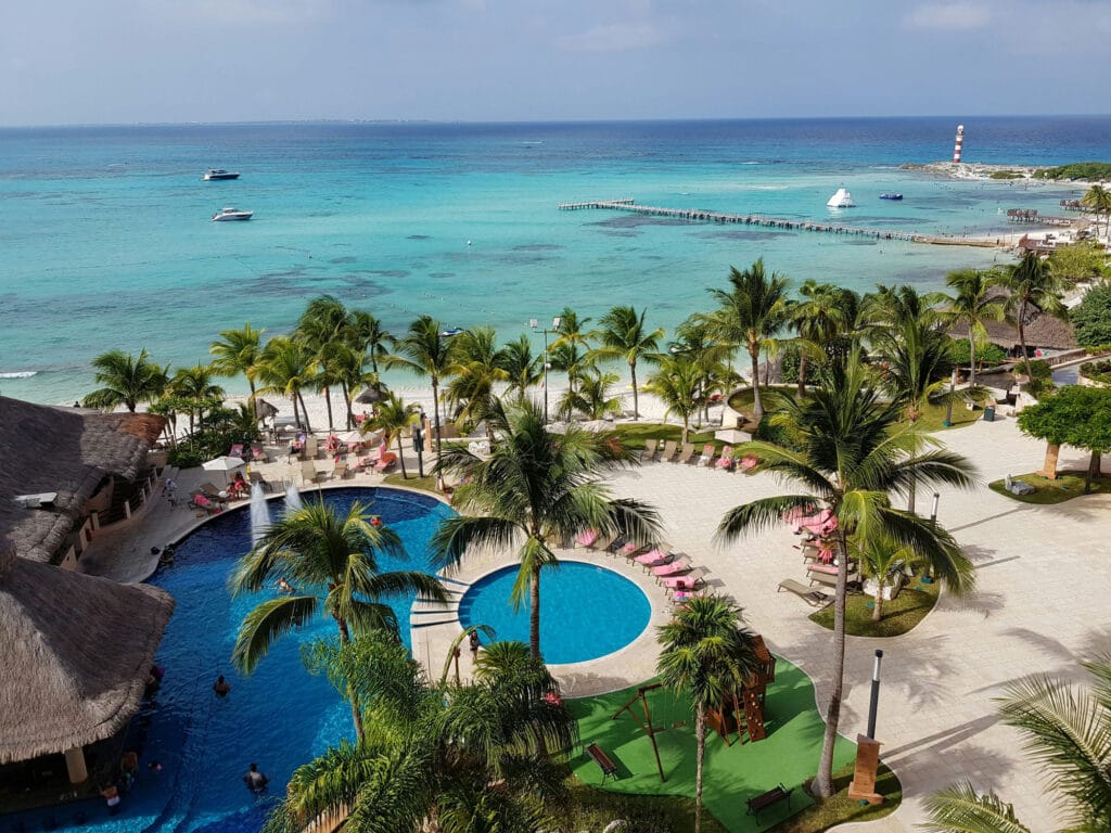 Family resort pools and beachfront seen from above