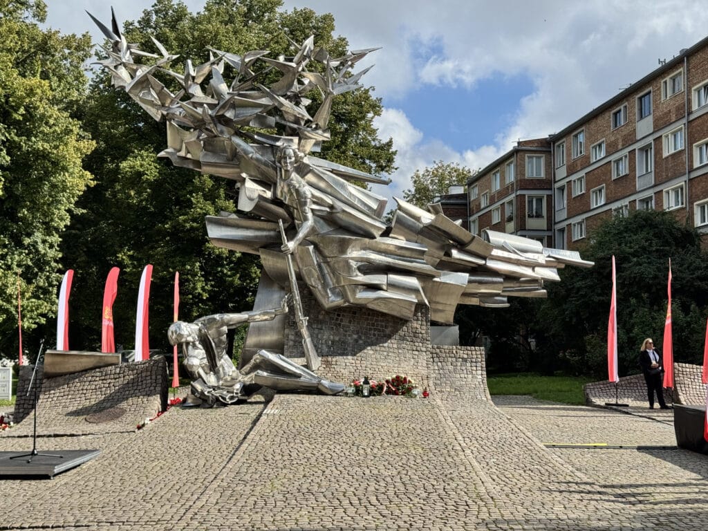 Flowers and Polish flags banked at the foot of the monument to the defenders of the Polish Post Office in Gdańsk