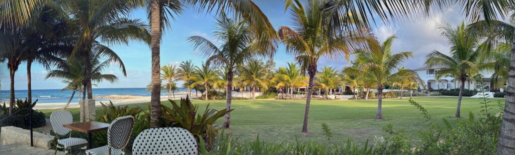 Wide view of palms, lawn and sea, north-coast Jamaica