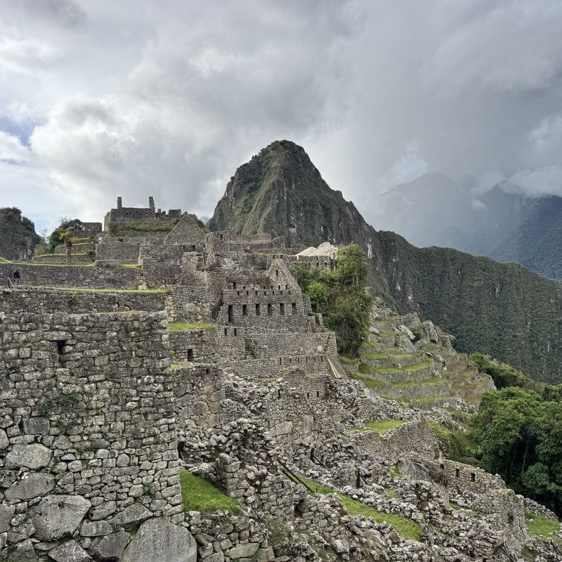 Stone terraces and buildings of the Machu Picchu citadel below Huayna