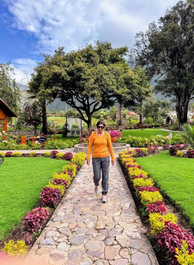 Milli Gupta on a garden path at a hotel in Urubamba, Sacred Valley, Peru.