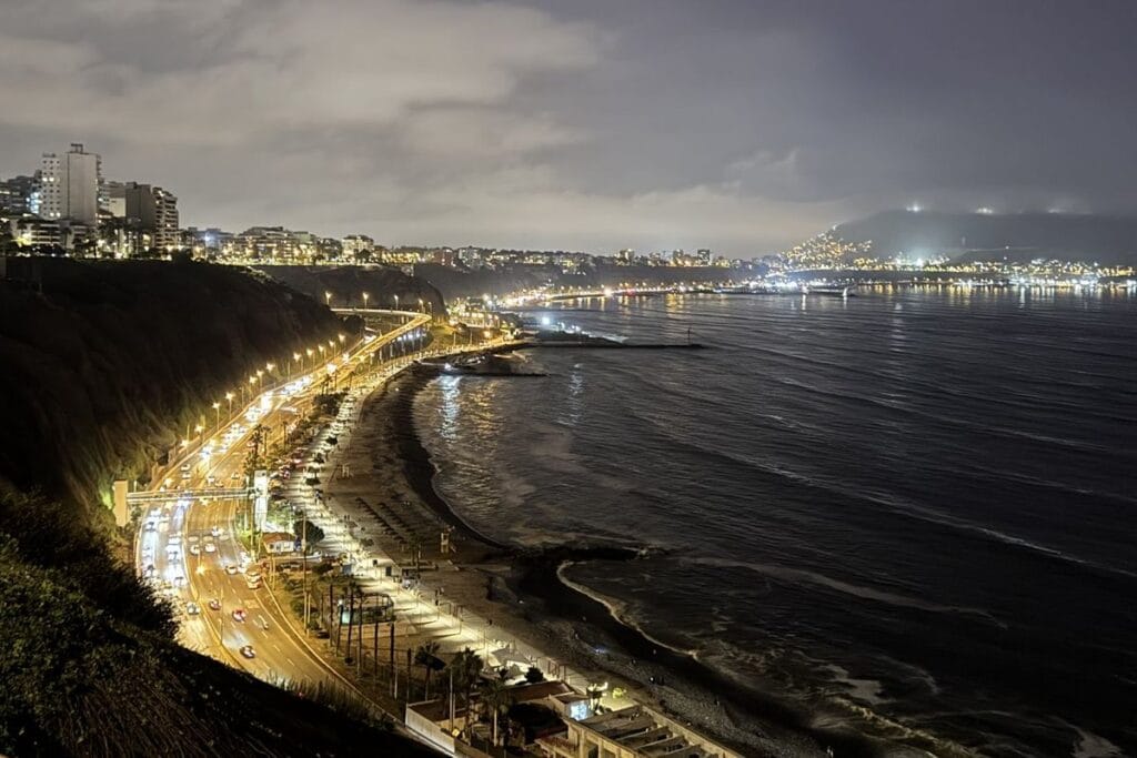 Miraflores clifftop and coastline at night, Lima, Peru