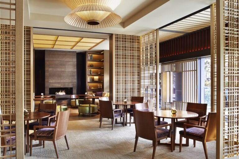 Lobby lounge at The Ritz-Carlton, Kyoto, with lattice screens, a fireplace and low seating